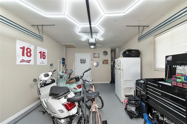 garage featuring a garage door opener and white refrigerator