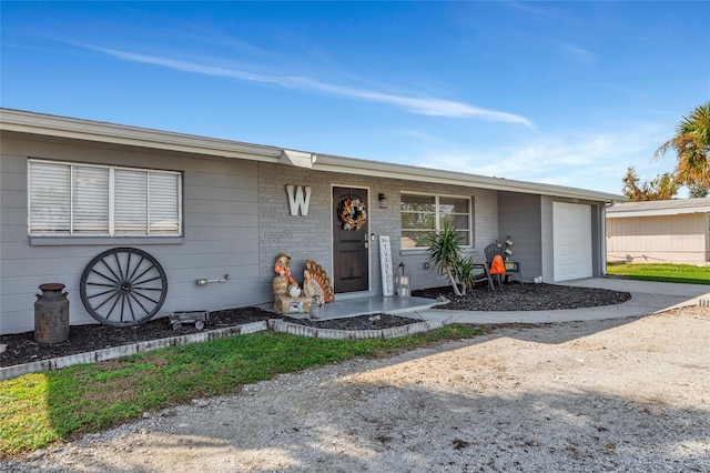 single story home featuring a garage