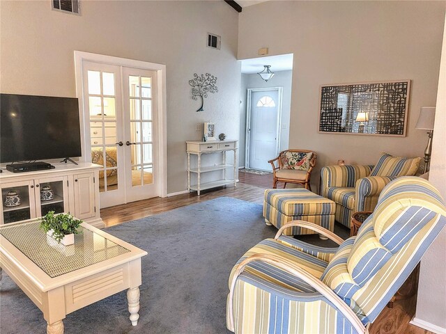 living room featuring dark hardwood / wood-style floors and french doors