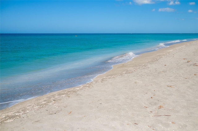 view of water feature with a beach view