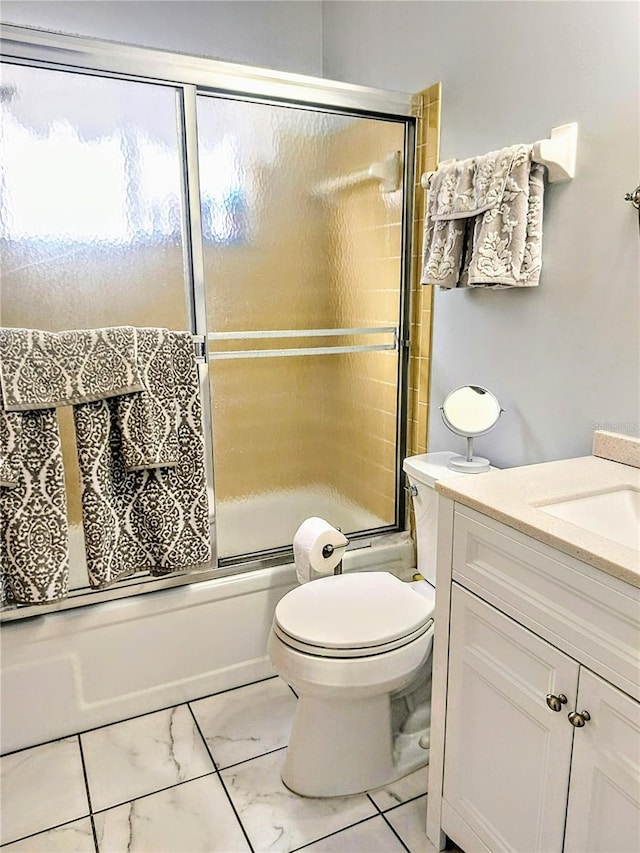 full bathroom featuring vanity, toilet, and enclosed tub / shower combo