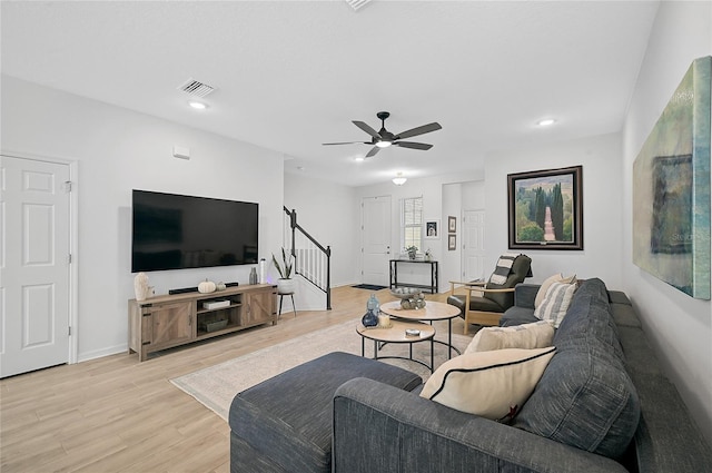 4008 Via Sienna Cir, Sarasota, FL 34243 - living area featuring stairs, light wood-style floors, a ceiling fan, baseboards, and recessed lighting