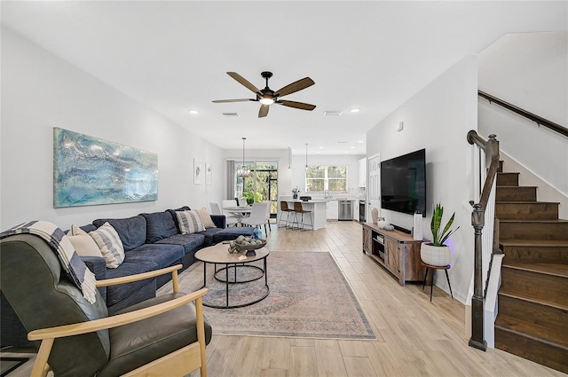 4008 Via Sienna Cir, Sarasota, FL 34243 - living area featuring a ceiling fan, light wood-style floors, stairs, and recessed lighting