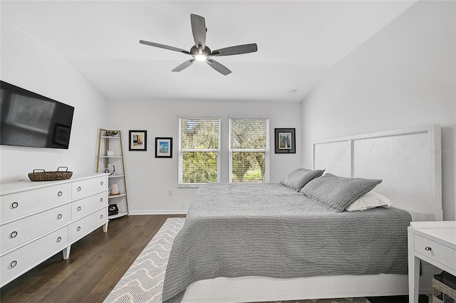 4008 Via Sienna Cir, Sarasota, FL 34243 - bedroom with dark wood-type flooring, lofted ceiling, a ceiling fan, and baseboards