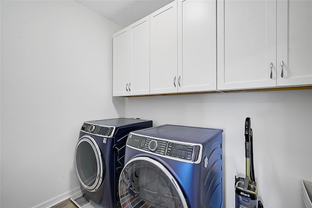 4008 Via Sienna Cir, Sarasota, FL 34243 - laundry room with cabinet space, washing machine and dryer, and baseboards