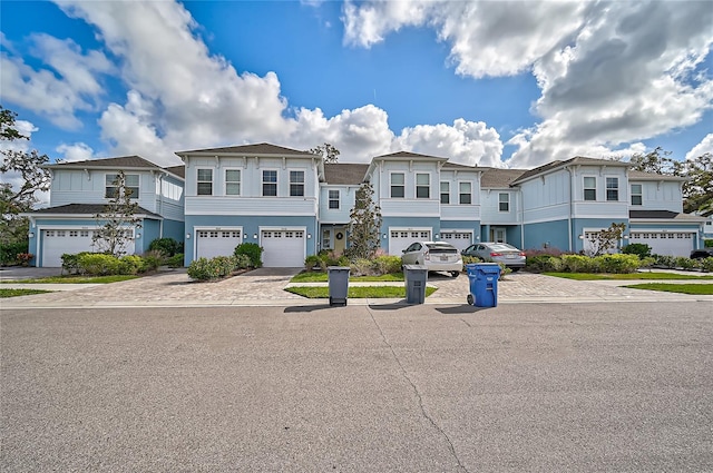 4008 Via Sienna Cir, Sarasota, FL 34243 - view of front of property with driveway, a garage, and a residential view