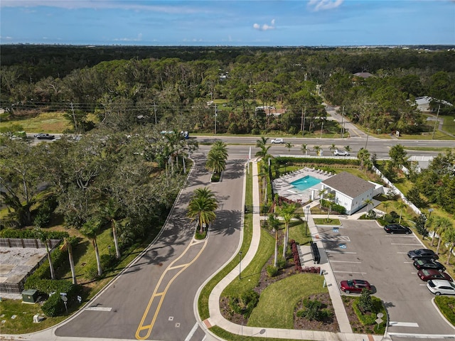 4008 Via Sienna Cir, Sarasota, FL 34243 - view of property location with a heavily wooded area and a pool