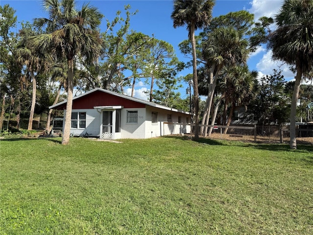 back of house with a yard