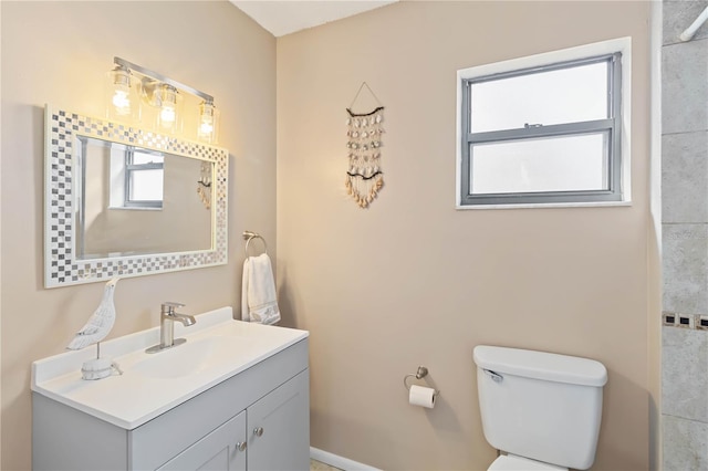 bathroom with toilet and vanity