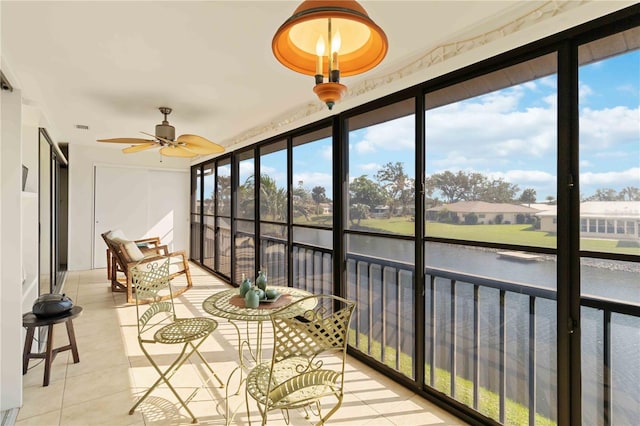 unfurnished sunroom featuring a wealth of natural light and ceiling fan