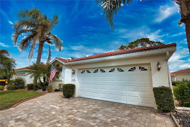 mediterranean / spanish house with a garage