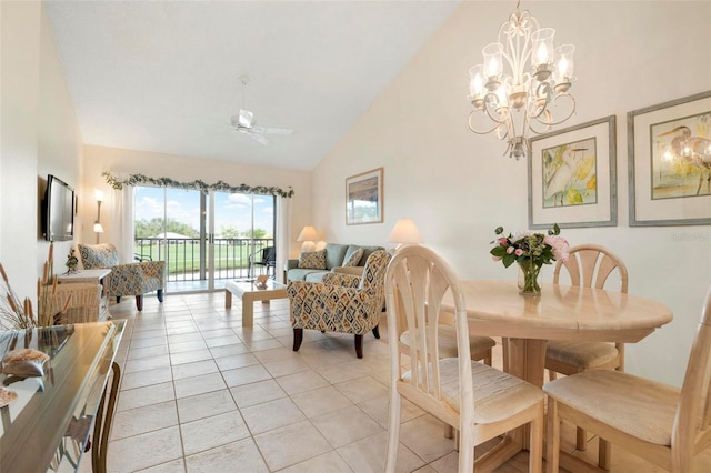 dining space with high vaulted ceiling, light tile patterned flooring, and ceiling fan with notable chandelier