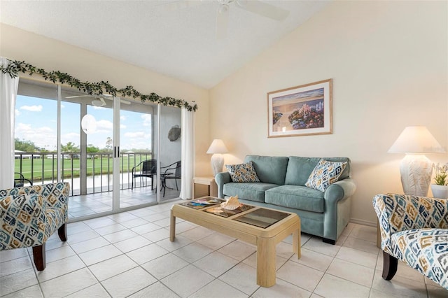 living room featuring light tile patterned floors, ceiling fan, and lofted ceiling