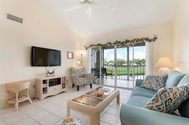 living room with light tile patterned floors, high vaulted ceiling, and ceiling fan