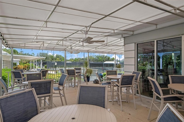 exterior space featuring ceiling fan