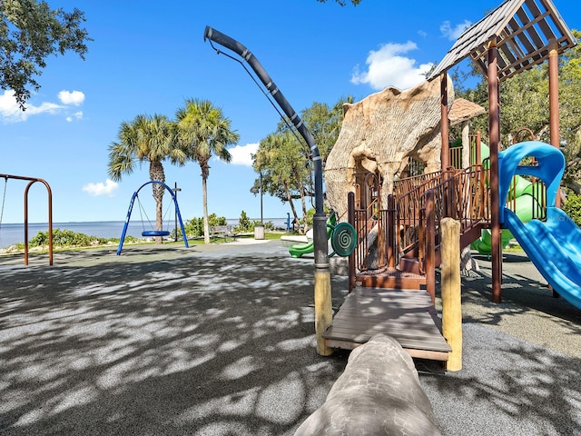 view of jungle gym with a water view