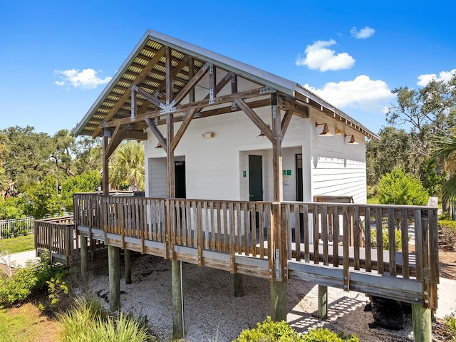 rear view of property with a wooden deck