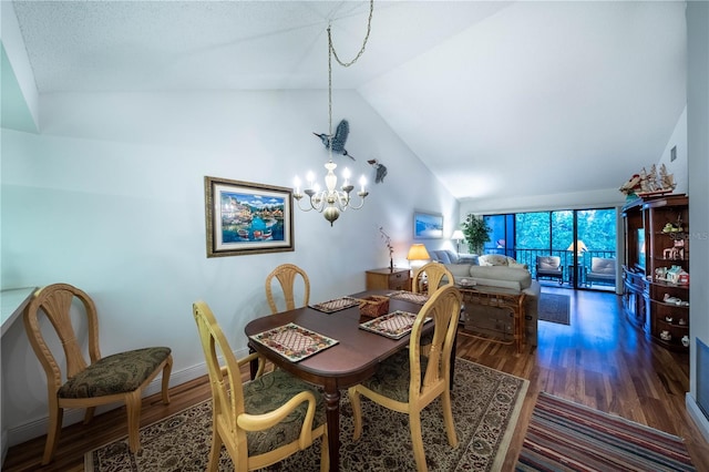 dining room featuring a chandelier, dark hardwood / wood-style floors, and vaulted ceiling