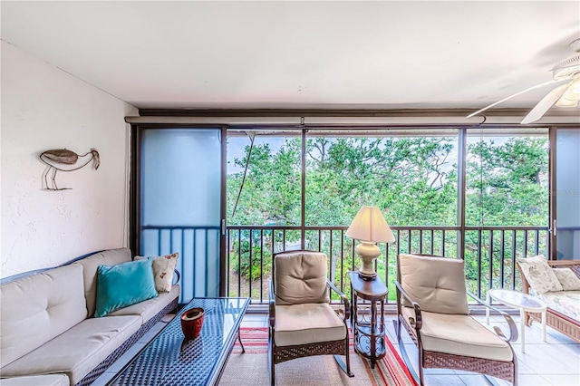 sunroom featuring ceiling fan and a healthy amount of sunlight