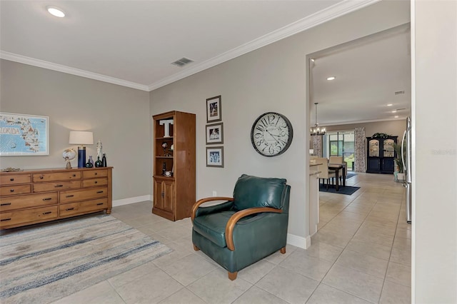 sitting room featuring light tile patterned floors, ornamental molding, and a notable chandelier