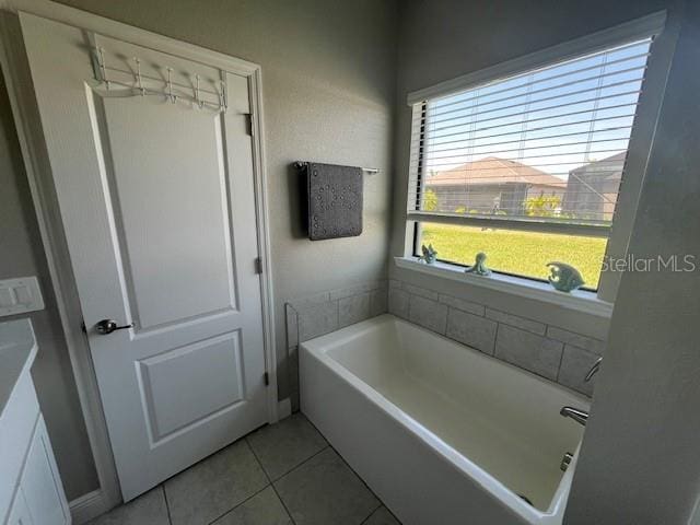 bathroom featuring tile patterned floors and a bathing tub