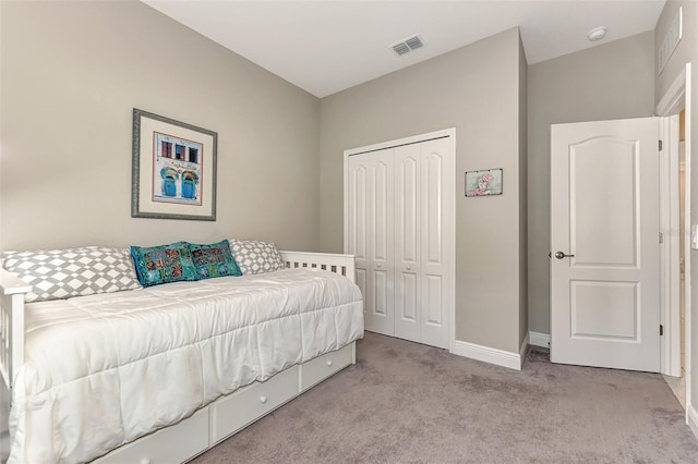 carpeted bedroom featuring a closet