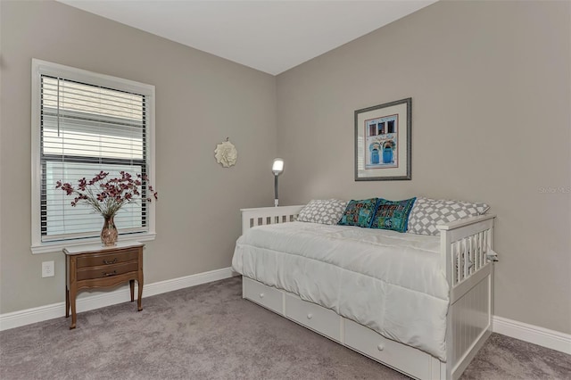 bedroom featuring light colored carpet