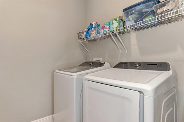 laundry area with separate washer and dryer