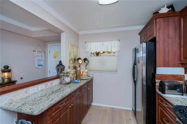 kitchen with light stone countertops, ornamental molding, light hardwood / wood-style floors, kitchen peninsula, and stainless steel appliances