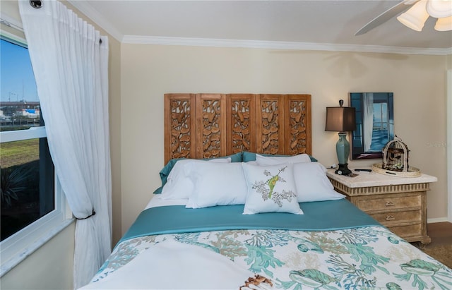 bedroom with ceiling fan and ornamental molding