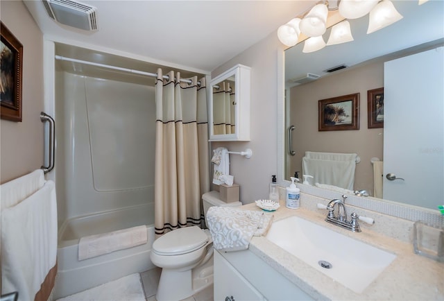 bathroom featuring tile patterned flooring, vanity, and toilet