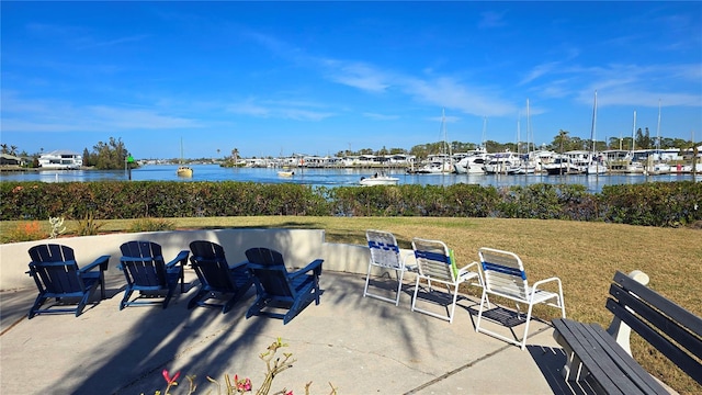 view of patio with a water view