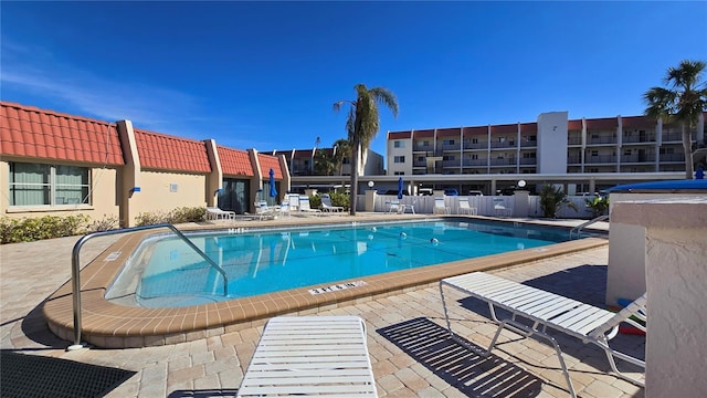 view of swimming pool featuring a patio area