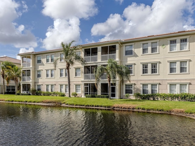 view of building exterior featuring a water view