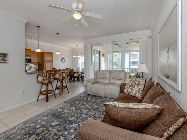 living room featuring light tile patterned floors, ceiling fan with notable chandelier, a textured ceiling, and crown molding