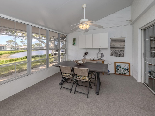 1141 Sleepy Hollow Ct, Venice, FL 34285 - sunroom / solarium with plenty of natural light, a water view, and carpet floors