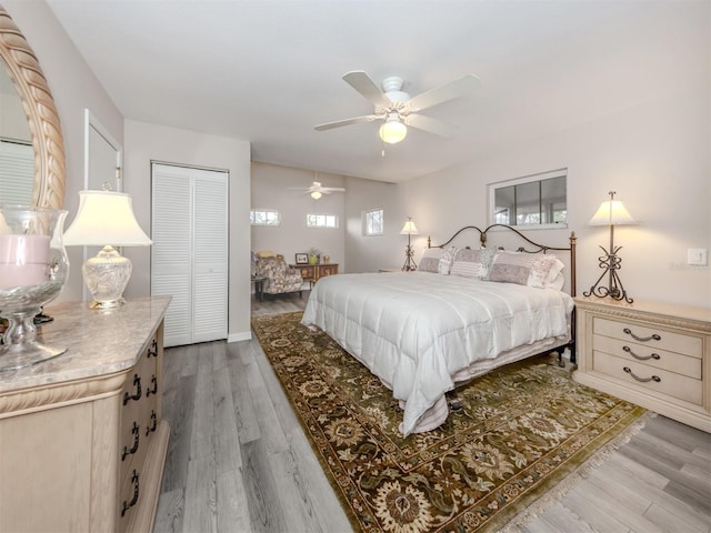 1141 Sleepy Hollow Ct, Venice, FL 34285 - bedroom with multiple windows, light wood-style floors, and ceiling fan