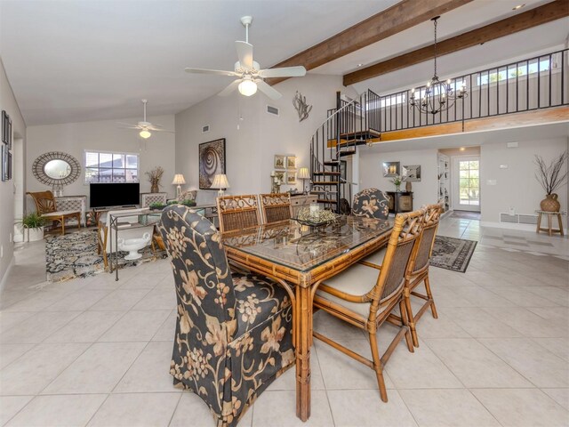 1141 Sleepy Hollow Ct, Venice, FL 34285 - dining room with stairs, ceiling fan, a chandelier, light tile patterned floors, and high vaulted ceiling