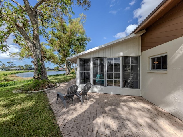 view of patio / terrace featuring a water view