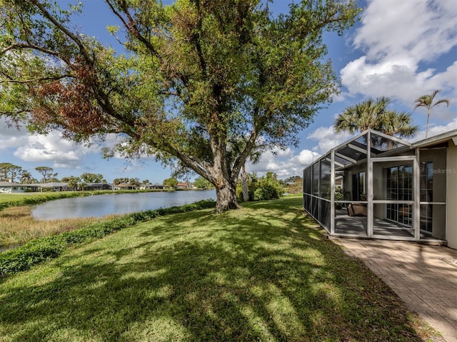 1141 Sleepy Hollow Ct, Venice, FL 34285 - view of green lawn featuring a water view, a patio area, and a lanai