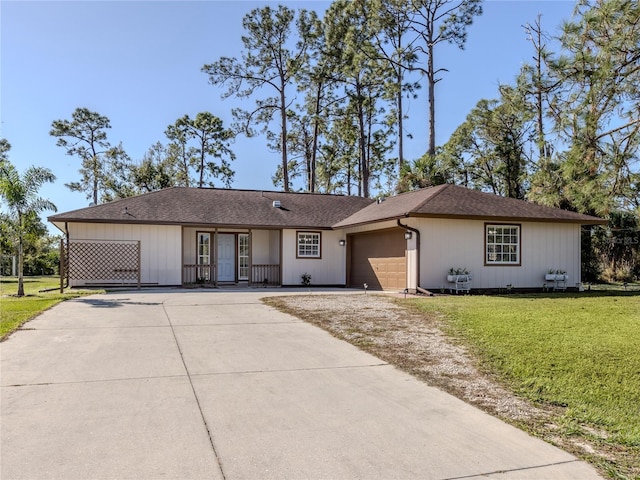 ranch-style home with a front lawn and a garage