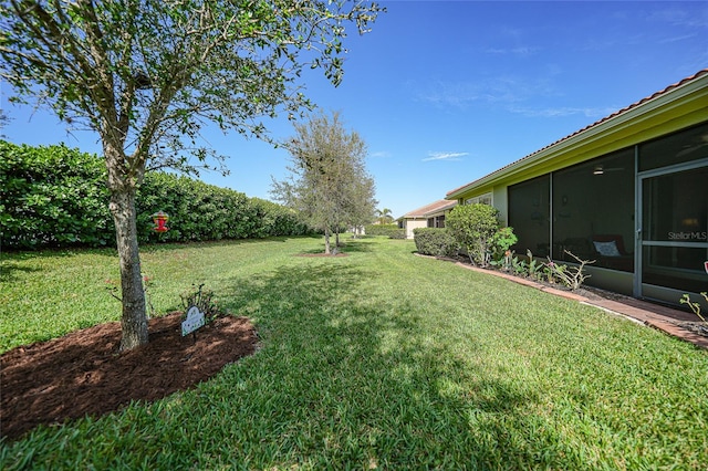 view of yard featuring a sunroom