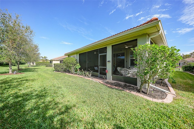 view of yard with a sunroom