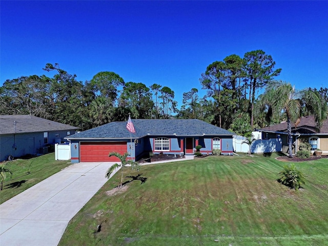 single story home featuring a front yard and a garage