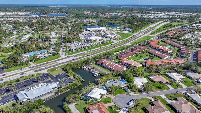 bird's eye view featuring a residential view and a water view