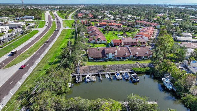 bird's eye view with a residential view and a water view