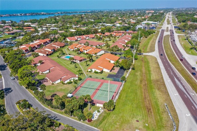 birds eye view of property featuring a residential view and a water view