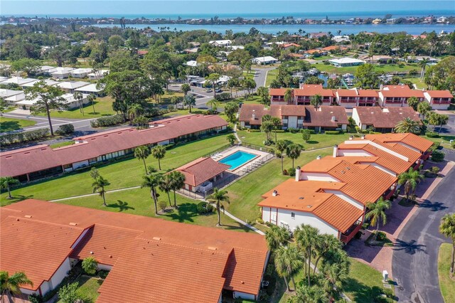 drone / aerial view featuring a water view and a residential view