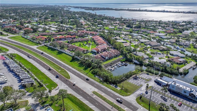 bird's eye view with a water view and a residential view