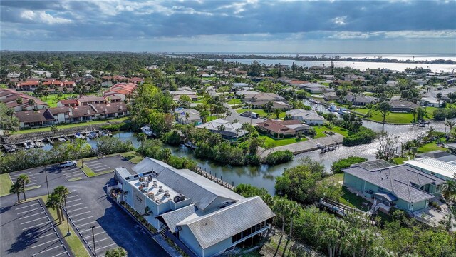 bird's eye view with a residential view and a water view